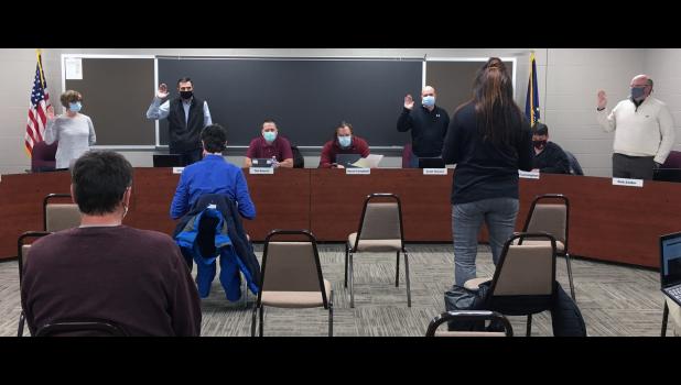 Four Eastern Pulaski Community School Corporation Board members were sworn in Monday evening before the regular meeting. Corporation treasurer Angie Anspach led Beth Ruff, Jimmy Terry, Scott Hanson and Rob Zeider in their oath of office.