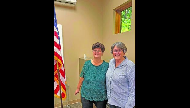 Photo provided. The Pulaski County Republican Precinct Committee Members recently selected Theresa Calloway (left) as the new Pulaski County Assessor. She is welcomed by former assessor Holly VanDerAa.