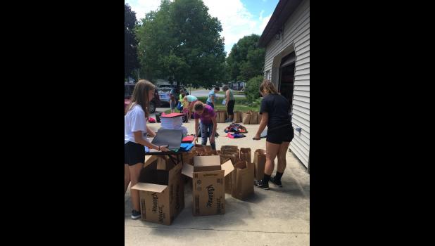 Members of the First United Methodist Church Sunday school helped organize and pack the backpacks on Sunday. Photo Submitted