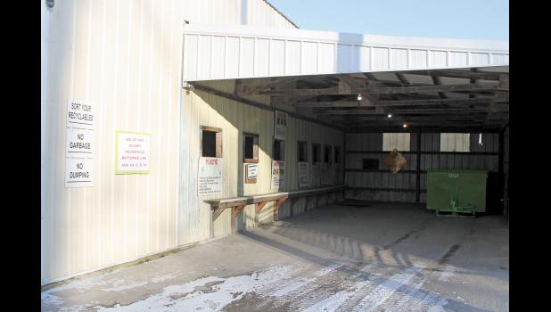 A carport area gives those who recycle a place to sort their items before placing them in the correct recycling bins.