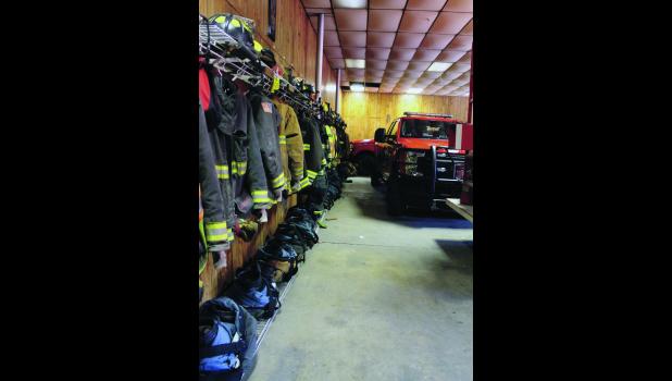 The Medaryville/White Post Volunteer Fire Department lacks space so much that the firefighters’ gear lines one long wall and is exposed to the exhaust of the vehicles.