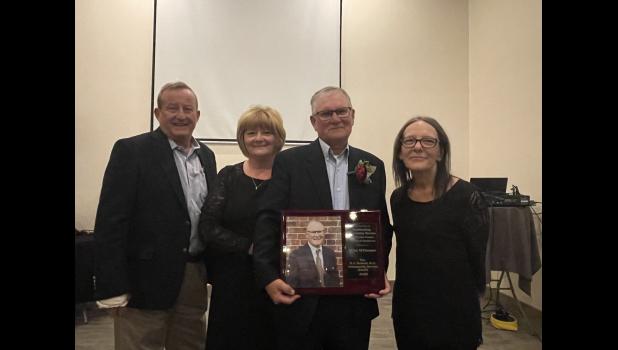 Photo by Megan Galbreath Michael O’Connor was recognized as the 2023 H.J. Halleck Community Service Award recipient on the evening of Nov. 6 in Winamac. Pictured with Michael and his wife, Sherry, 1992 recipient Dan Frain and Pulaski County Chamber of Commerce President Amy Cantu.