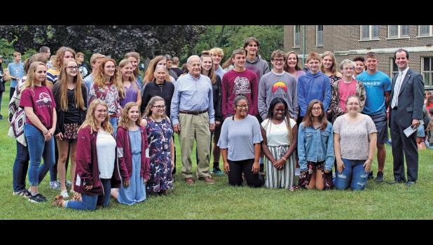 Mr. Frank Grunwald, survivor of Auschwitz, along with his wife, Barbara, pose for a photo with the Winamac Community High School cast of the 2019 fall play, “And Then They Came for Me: Remembering the World of Anne Frank.” Photo by Sophie Dickinson