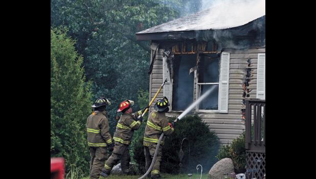 Firefighters from North Judson, Medaryville and Winamac were dispatched Monday, Aug. 13, to battle a house engulfed in fire.