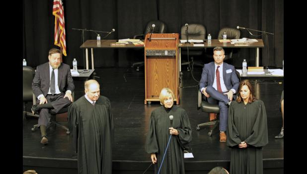 Judges and attorneys interact with students and faculty during a question and answer session.