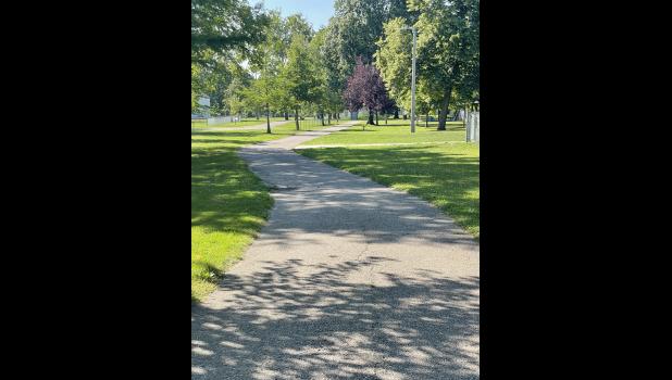 Photo by Megan Galbreath The Winamac parks board is looking into repaving the walking trail in the town park.