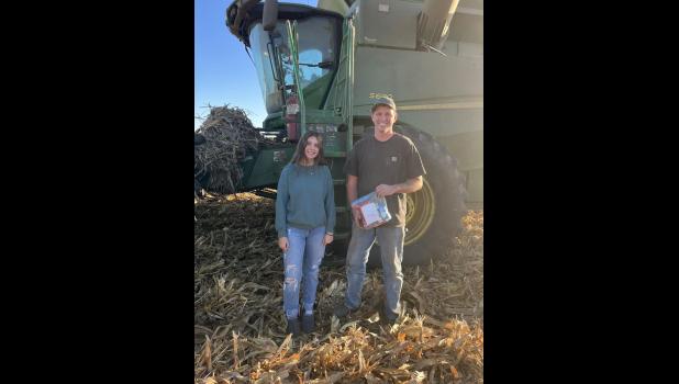 Photo provided. Jersey Stevens, Winamac Community High School sophomore, delivers a snack bag to local farmer, Alan Kestle.
