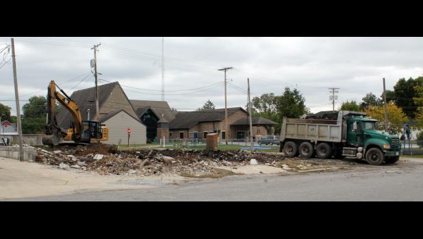 The former Freeman property is receiving a new look as debris is being removed and the lot turned into a small landscaped space.