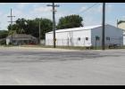 Wear and tear can be seen at the intersection of Bill and Lyman streets in Francesville, as semis make a turn onto private property. 