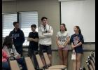 Photo by Megan Galbreath Eighth graders Hutch Martin, Kannon Hoover, Evan Burgess, Ava Malchow and Addyson Hines regularly share highlights from both sports and academic teams on the radio.