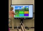 Photo by Megan Galbreath Technology Integration Specialist Shannon Burgess briefly demonstrated what the Promethean board can do at a regular school board meeting on April 10.