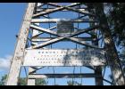 There is a small identifying sign on either side of the Memorial Swinging Bridge that names to whom the bridge is dedicated. Photo by Megan Galbreath.
