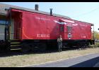 The Erie Railroad caboose in downtown Winamac has been repainted by scout Carrie Nichols as her Eagle Scout project.