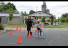 Officer Shelby Pickens follows a rider as she maneuvers around traffic cones.