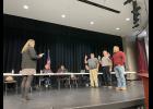 Photo by Megan Galbreath Corporation treasurer Stefanie Grandstaff conducted the swearing-in ceremony for school board members Joe Cunningham, Tim Rausch and Aaron Campbell during a regular board meeting on Jan. 9.
