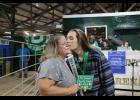 Aidan Smith’s kiss was bought by his mother, Amy Smith, for $1,500.