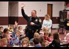 Winamac Police Chief Tyler Campbell welcomes the kindergarten students to "Pop Tarts with Police." 