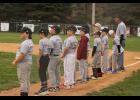 Lined up and ready to "Play Ball." Teams wait with anticipation for the season to begin.