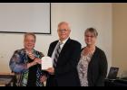 The Light Up Our Legacy Memorial Swinging Bridge Project receives the 2023 Non-Profit of the Year award. Pictured (L to R) are Kathi Thompson and Greg and Brenda Henry.