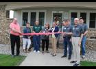 Community Foundation of Pulaski County Executive Director Leeann Wright cuts the ribbon with the ceremonial scissors.