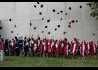 A very happy West Central High School class of 2016 celebrate by throwing their caps.