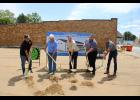 Tom Miller of TM Construction, Steve Morrison, President of the First National Bank of Monterey Bob Cannedy, Pulaski County Historical Society President Ryan Harrison and Jimmy Terry of FBI Buildings take a ceremonial dig into the dirt, breaking ground on the new historical society museum in downtown Winamac on Monday, Aug. 12.