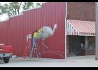 Artist Zach Medler is beginning on phase one of the Pulaski County Tribe sandhill crane mural project located on the corner of Main and National streets in Medaryville.