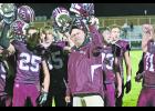 Winamac head coach Tim Roth joins his players to sing the Warrior fight song.