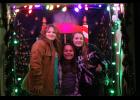 Friends Kati Baker, Rylie Reinhold and Adyson Reinhold are in a festive mood waiting for the start of the Winter Wonderland parade Friday evening.