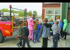 Eastern Pulaski Elementary second-grade students spent the day visiting the Winamac Fire Station in honor of Fire Prevention Week. Firefighter Bill Weaver explained the functions of a brush truck with the students. He also answered any questions they had.