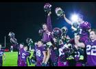 Winamac head coach Tim Roth is lifted by his players after the Warriors beat Bremen 21-14 for the sectional championship. 
