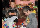 Maddox Gutwein, 9, Francesville, and Paetyn Koebcke, 9, Medaryville, eyed the candy they found in their eggs during Parkview Haven’s annual egg hunt, held Saturday, March 24.