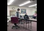 Photo by Megan Galbreath Beth Crawford shows the Winamac Parks Board an example of the proposed frame for the “story walk in the park” project.