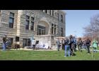 Numerous community leaders gathered on the courthouse lawn on April 19 in recognition of April being Child Abuse Awareness month.