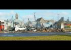 More than a year and a half after a fire that destroyed two buildings, the rubble has yet to be removed from one of the lots.
