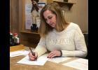 Lynn Wilder, who is acting as interim county clerk, led JoLynn Behny Johnston in the oath of office on Dec. 19, a day after she was appointed to the position during a Republican caucus.