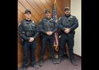 New Winamac Town Officers Aaron Coppernoll (left) and Brett Funk (right) joined Winamac Police Chief Branson Eber at the Feb. 10 town board meeting.
