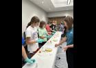Photo provided. Along with learning about the different career opportunities in the field, students got hands-on experience with simulated medical procedures, such as learning how to place an IV in a banana and giving intramuscular injections in an orange.